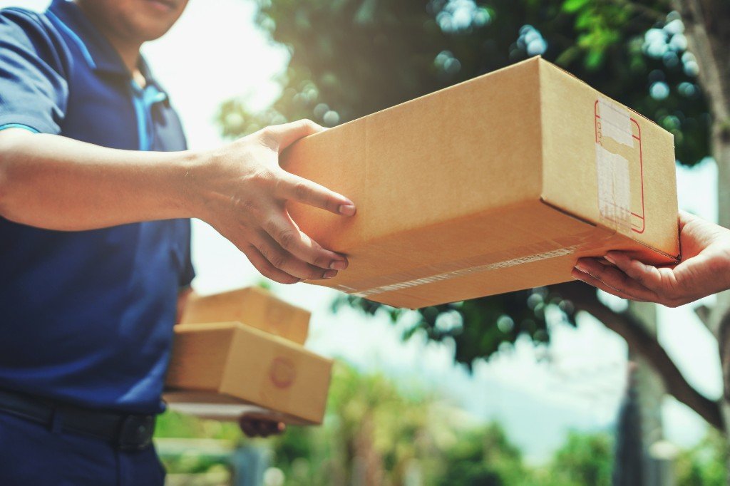 ALS Express courier delivering parcel to customer